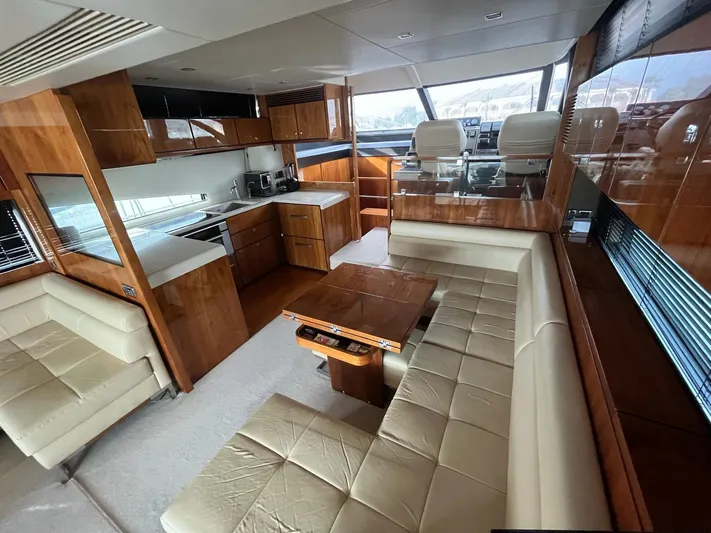  Yacht Photos Pics Luxurious interior of 2010 Fairline Squadron 65 yacht with modern kitchen and seating area.