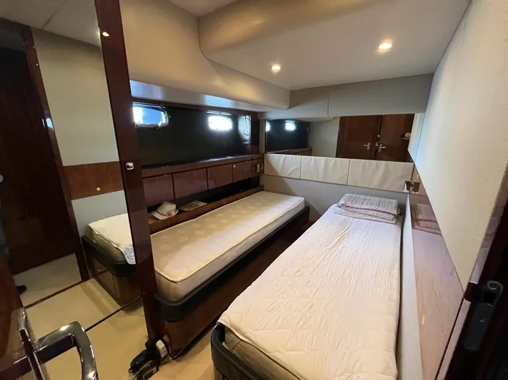  Yacht Photos Pics Cabin interior of 2010 Fairline Squadron 65 yacht with twin beds and modern design.