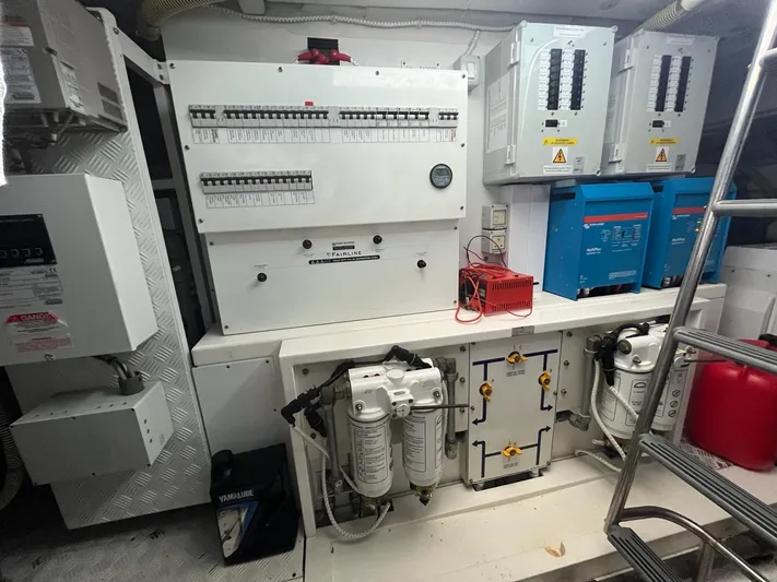  Yacht Photos Pics Electrical control room of 2010 Fairline Squadron 65 yacht, featuring panels and equipment.