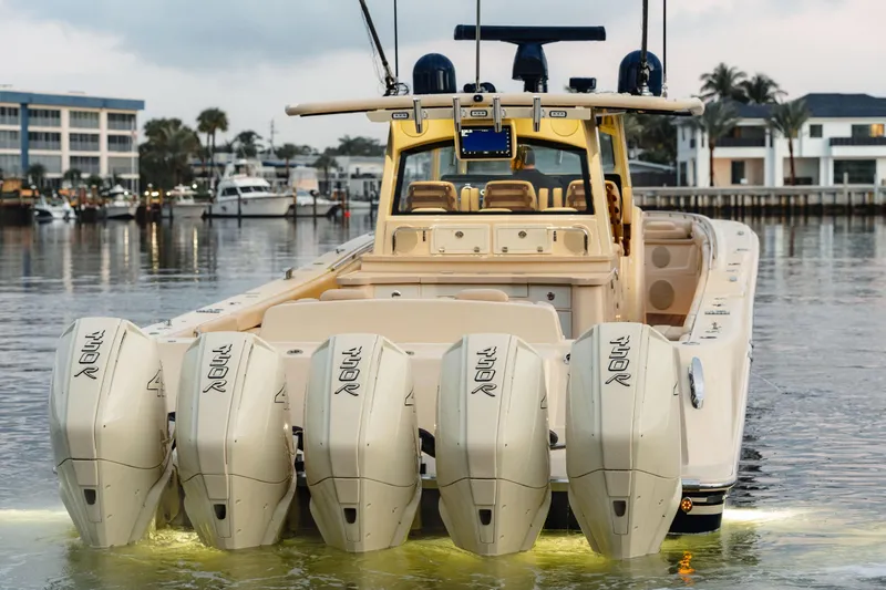  Yacht Photos Pics 2022 HCB 53 Sue&ntilde;os boat with five powerful outboard engines docked in marina.