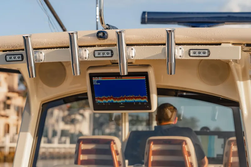  Yacht Photos Pics 2022 HCB 53 Sue&ntilde;os boat dashboard with navigation screen and rod holders.