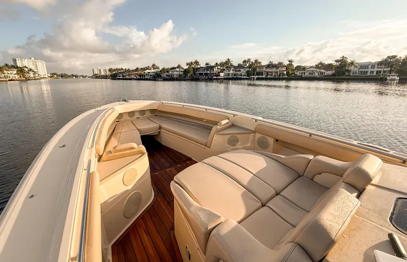  Yacht Photos Pics Luxurious 2022 HCB 53 Sue&ntilde;os yacht interior with plush seating on calm waters.
