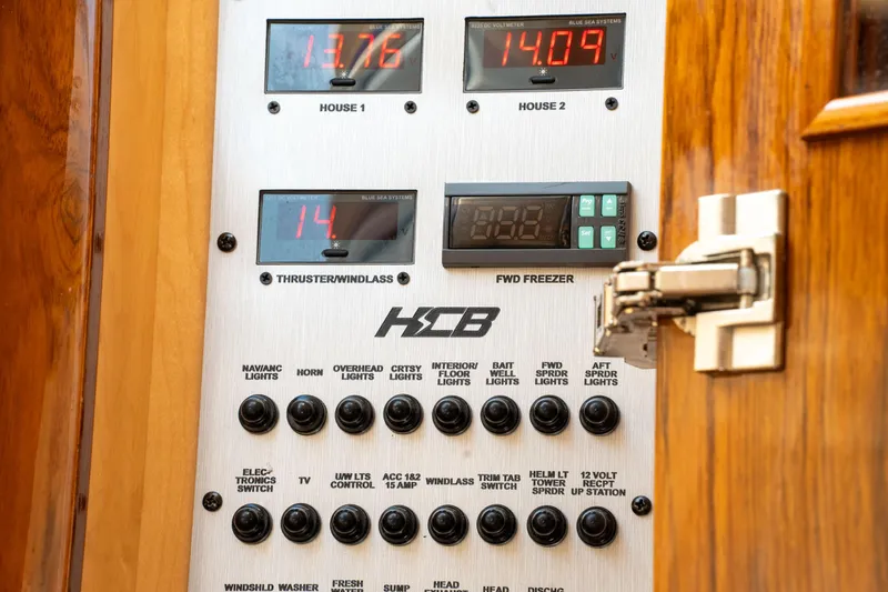  Yacht Photos Pics Control panel of 2022 HCB 53 Sue&ntilde;os boat with various switches and digital displays.