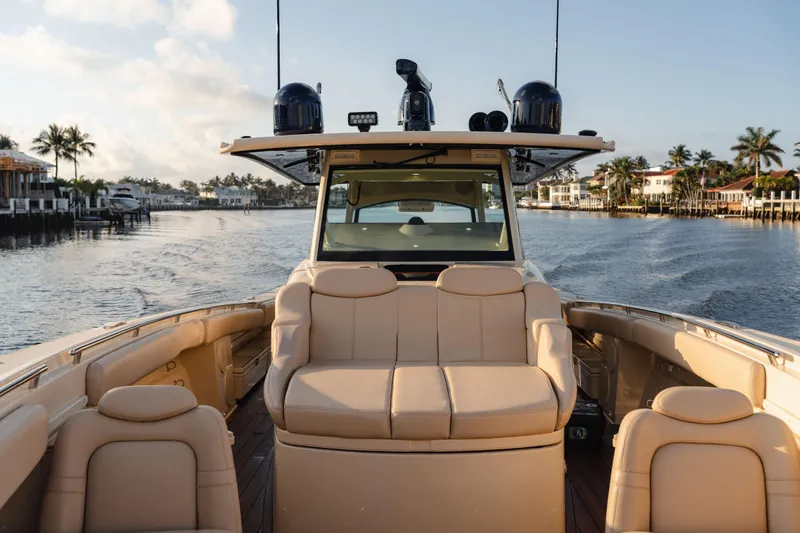  Yacht Photos Pics 2022 HCB 53 Sue&ntilde;os boat interior with luxurious seating on a calm waterway.