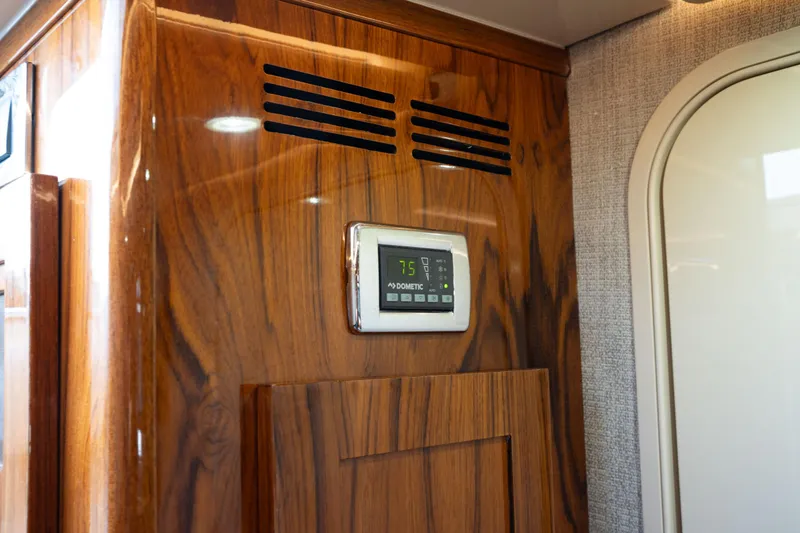  Yacht Photos Pics Wooden interior panel with digital control display on 2022 HCB 53 Sue&ntilde;os boat.