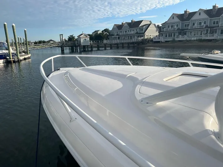  Yacht Photos Pics 2018 Intrepid 375 Walkaround boat docked near waterfront homes.