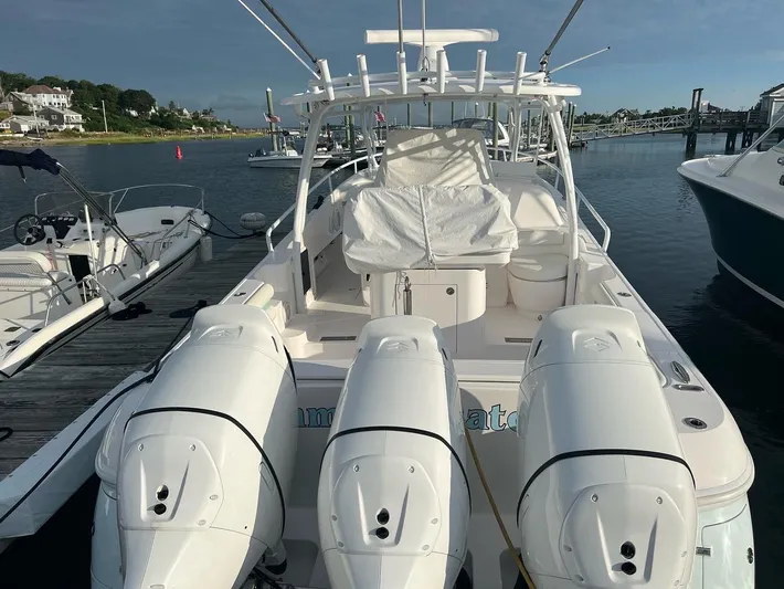  Yacht Photos Pics 2018 Intrepid 375 Walkaround boat docked with triple outboard engines.