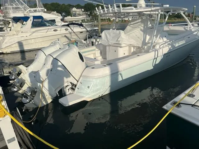  Yacht Photos Pics 2018 Intrepid 375 Walkaround boat docked at a marina.