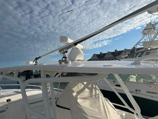  Yacht Photos Pics 2018 Intrepid 375 Walkaround boat docked under a partly cloudy sky.