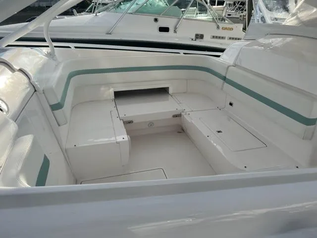  Yacht Photos Pics 2018 Intrepid 375 Walkaround boat interior with white and teal seating.