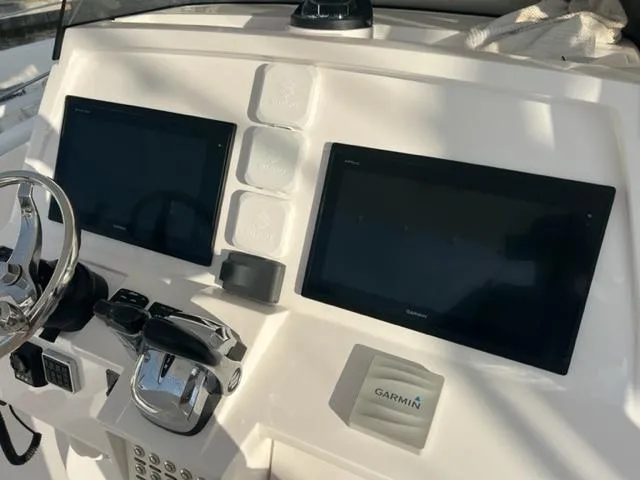  Yacht Photos Pics 2018 Intrepid 375 Walkaround helm with dual Garmin displays and controls.