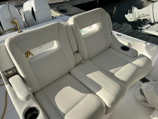  Yacht Photos Pics 2018 Intrepid 375 Walkaround boat with white cushioned seating and cup holders.