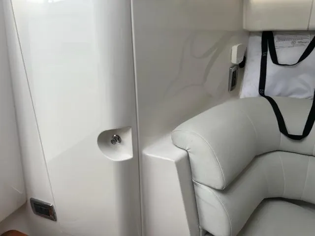  Yacht Photos Pics Interior seating of 2018 Intrepid 375 Walkaround boat with white upholstery.