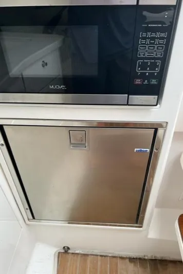  Yacht Photos Pics 2018 Intrepid 375 Walkaround kitchen with microwave and stainless steel fridge.