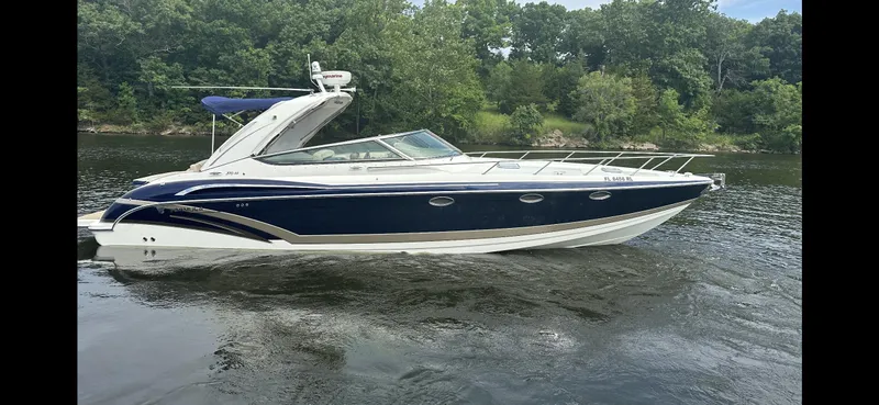  Yacht Photos Pics 2018 Formula 370 Super Sport boat on a calm river with lush green trees.
