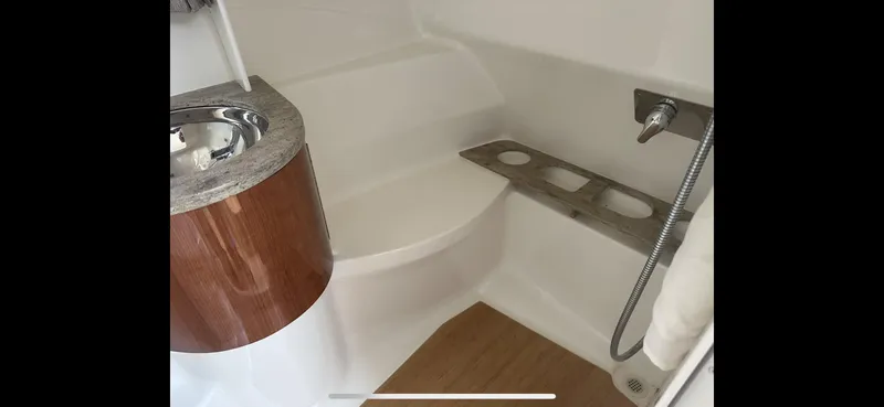  Yacht Photos Pics Interior of 2018 Formula 370 Super Sport boat, featuring a sleek sink and shower area.