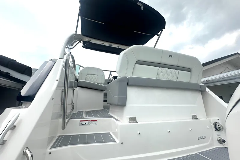  Yacht Photos Pics 2025 Regal 26 XO boat interior with cushioned seating and sleek design.