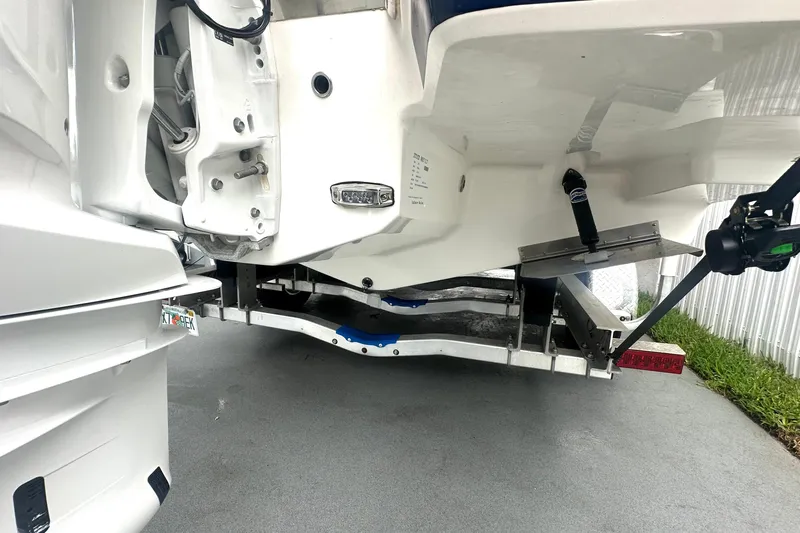  Yacht Photos Pics 2025 Regal 26 XO boat trailer view, showcasing the underside and mechanical components.