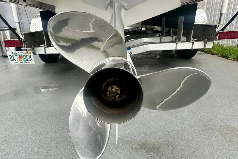  Yacht Photos Pics Propeller of a 2025 Regal 26 XO boat on a trailer, Florida license plate visible.