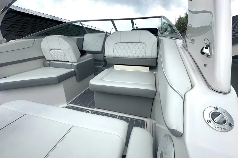  Yacht Photos Pics 2025 Regal 26 XO boat interior with luxurious white seating and modern design.