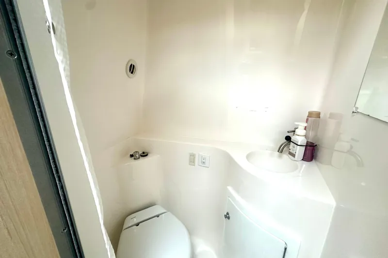  Yacht Photos Pics 2025 Regal 26 XO boat bathroom with compact toilet and sink.