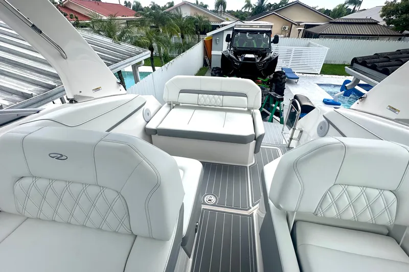  Yacht Photos Pics 2025 Regal 26 XO boat interior with white seating and modern design.
