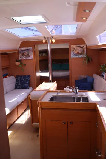  Yacht Photos Pics Interior of 2016 Dufour 382 Grand Large yacht with cozy seating and modern kitchen.