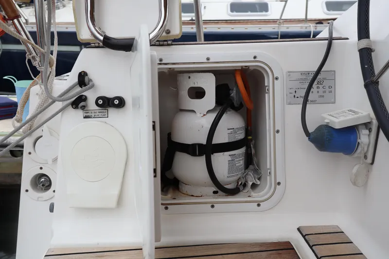  Yacht Photos Pics Dufour 382 Grand Large 2016 yacht propane storage compartment with secured gas cylinder.