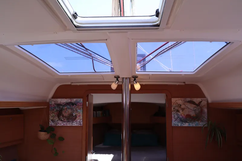  Yacht Photos Pics Interior view of 2016 Dufour 382 Grand Large sailboat with skylights and cozy decor.