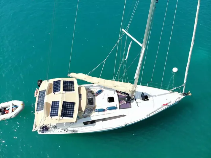  Yacht Photos Pics 2016 Dufour 382 Grand Large sailboat with solar panels on turquoise water.