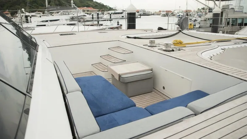 Kailua Yacht Photos Pics Luxurious Sunreef 74C yacht deck with blue seating, docked at a marina, 2018 model.