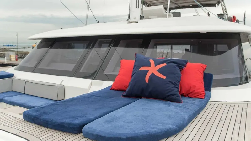 Kailua Yacht Photos Pics Luxurious Sunreef 74C yacht deck with blue and red cushions, 2018 model.