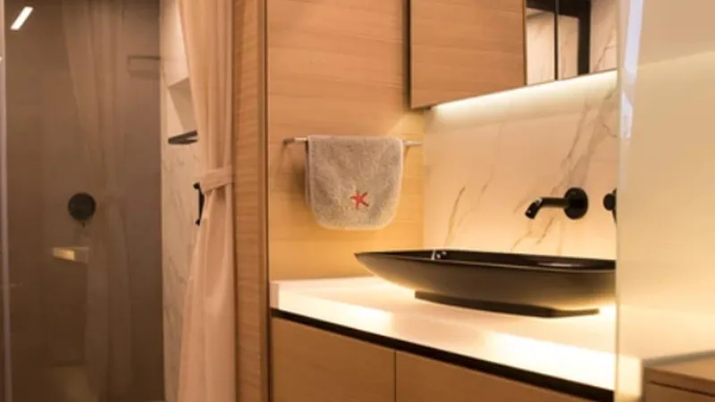 Kailua Yacht Photos Pics Luxurious bathroom interior of 2018 Sunreef 74C yacht with modern fixtures and elegant design.