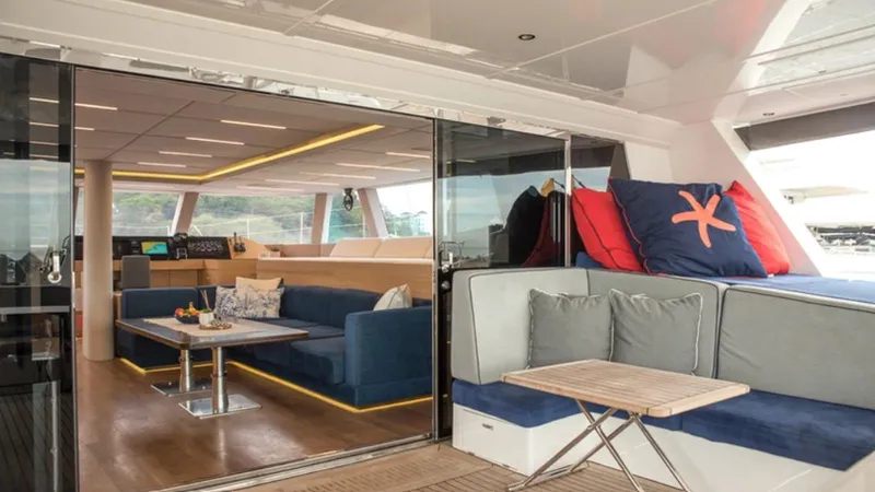 Kailua Yacht Photos Pics Luxurious interior of 2018 Sunreef 74C yacht with modern seating and decor.