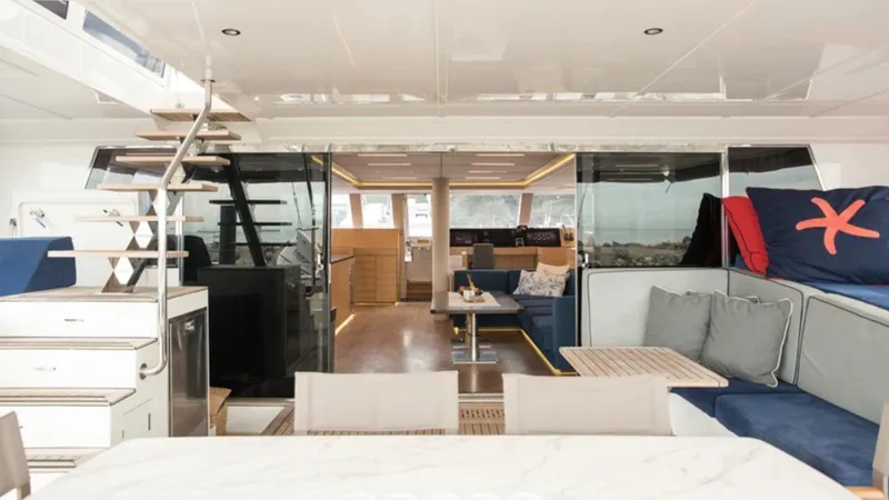 Kailua Yacht Photos Pics Luxurious interior of 2018 Sunreef 74C yacht with modern seating and elegant design.