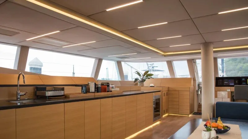 Kailua Yacht Photos Pics Luxurious interior of 2018 Sunreef 74C yacht with modern kitchen design.