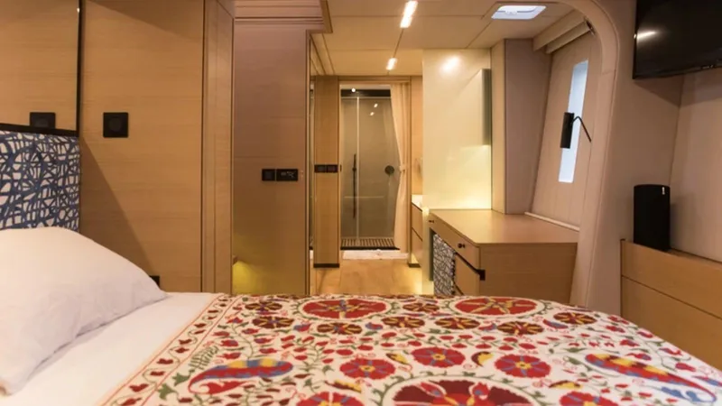 Kailua Yacht Photos Pics Luxurious Sunreef 74C 2018 yacht bedroom with elegant decor and modern amenities.