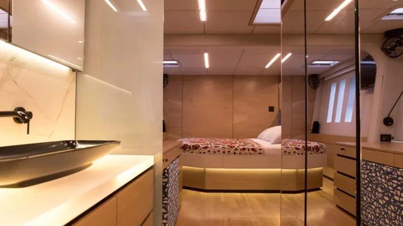 Kailua Yacht Photos Pics Luxurious interior of 2018 Sunreef 74C yacht with modern bedroom and elegant bathroom.