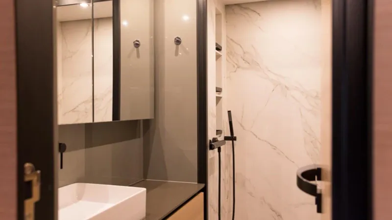 Kailua Yacht Photos Pics Luxurious bathroom interior of 2018 Sunreef 74C yacht with modern fixtures and marble accents.