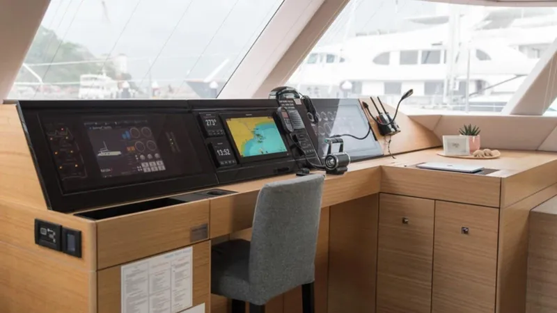 Kailua Yacht Photos Pics Luxurious Sunreef 74C yacht interior with navigation equipment, modern design, and comfortable seating.