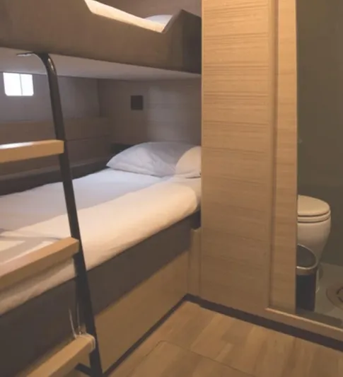 Kailua Yacht Photos Pics Interior of 2018 Sunreef 74C yacht with bunk beds and bathroom.