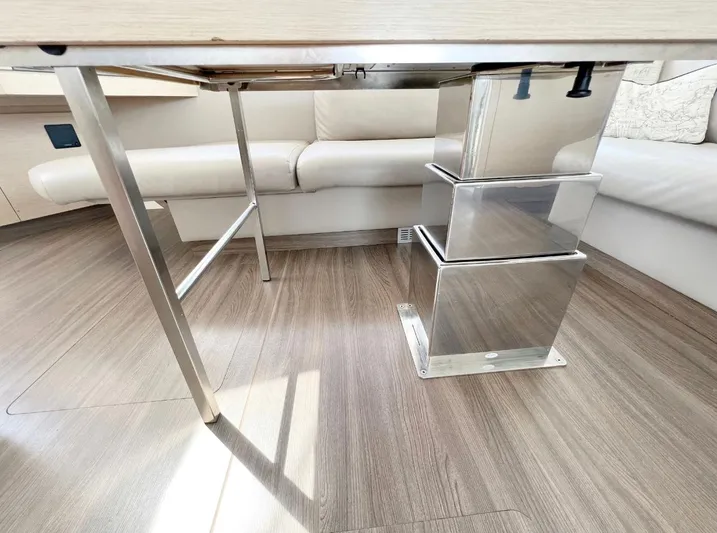  Yacht Photos Pics Interior of 2018 Fountaine Pajot Saona 47 with modern table design.