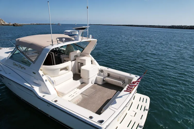 Gina Marie Yacht Photos Pics 1997 Tiara Yachts 3700 Open on calm water, featuring spacious deck and seating.