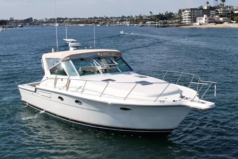 Gina Marie Yacht Photos Pics 1997 Tiara Yachts 3700 Open cruising on a calm, scenic waterway.