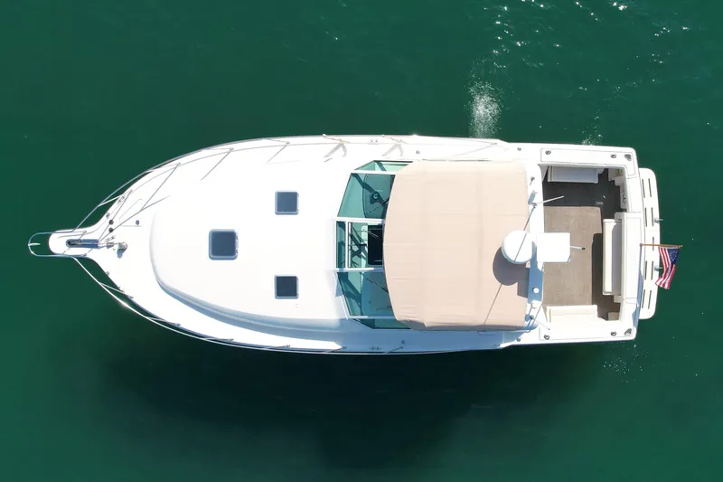 Gina Marie Yacht Photos Pics Aerial view of 1997 Tiara Yachts 3700 Open on calm water.