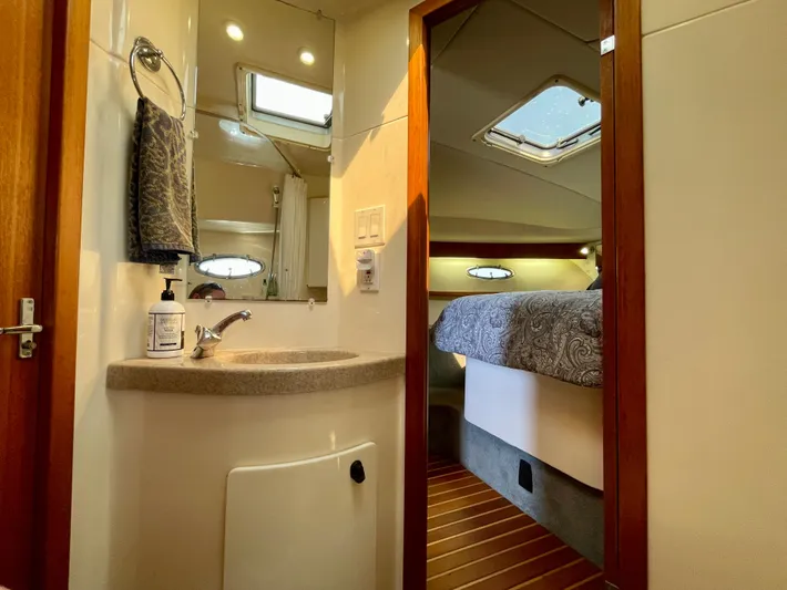 Gina Marie Yacht Photos Pics 1997 Tiara Yachts 3700 Open interior with bathroom and cozy bedroom view.