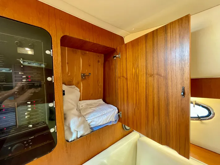 Gina Marie Yacht Photos Pics 1997 Tiara Yachts 3700 Open interior with wooden cabinet and electrical panel.