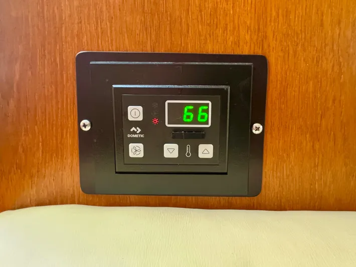 Gina Marie Yacht Photos Pics Digital thermostat on 1997 Tiara Yachts 3700 Open, displaying temperature setting of 66 degrees.