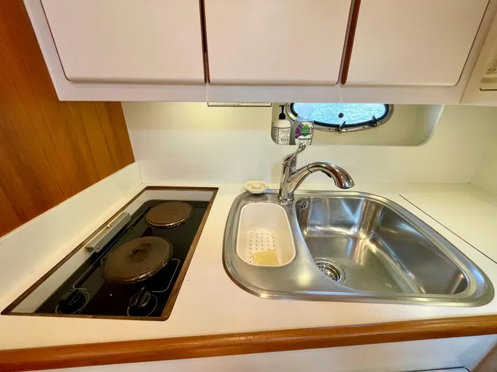 Gina Marie Yacht Photos Pics 1997 Tiara Yachts 3700 Open kitchen with sink and stove.