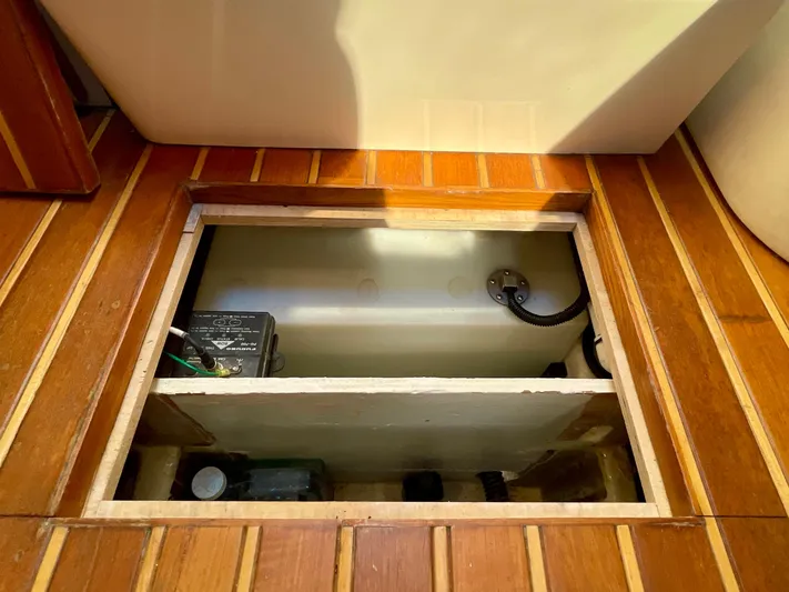 Gina Marie Yacht Photos Pics 1997 Tiara Yachts 3700 Open floor compartment with wooden finish and storage space.